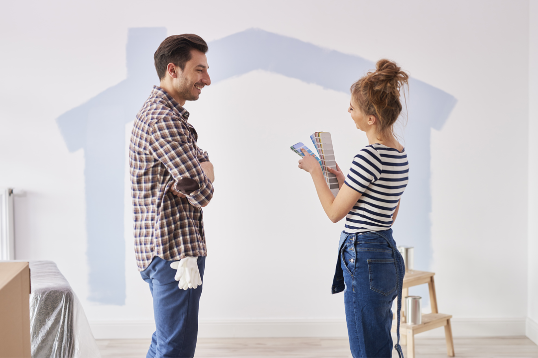 couple-painting-interior-wall-their-new-apartment.png